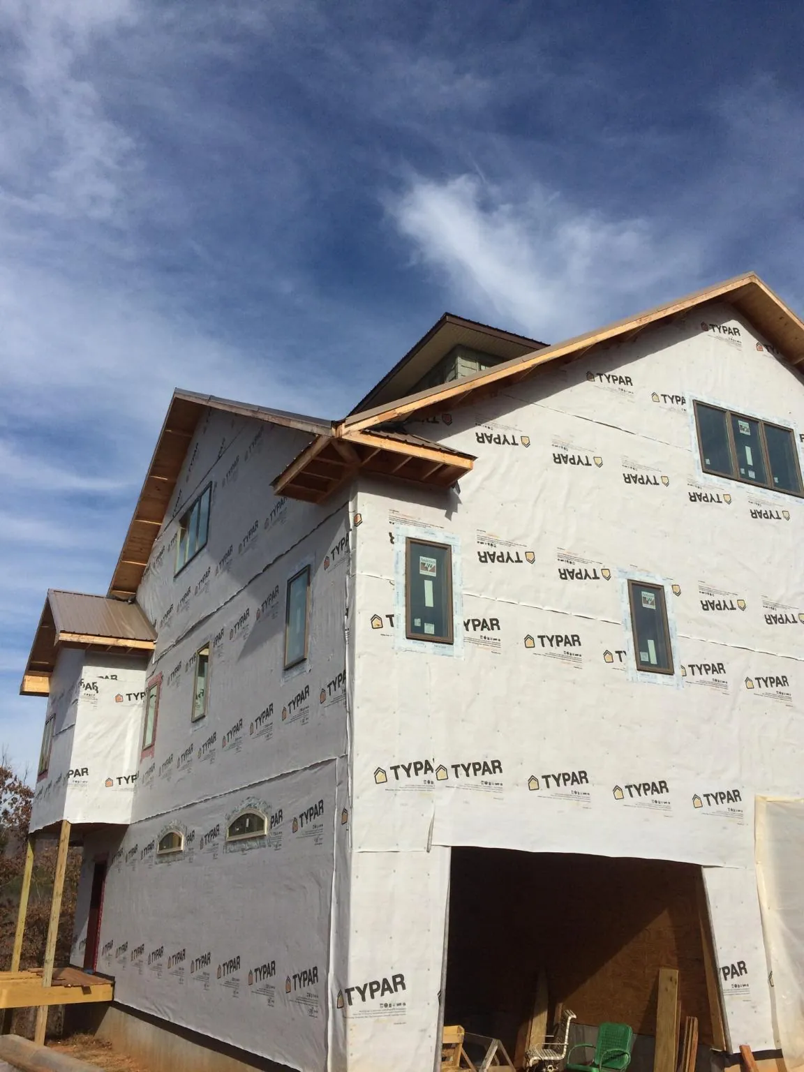 Stick built house wrapped in Typar with new roof framing and dormers in Hudson